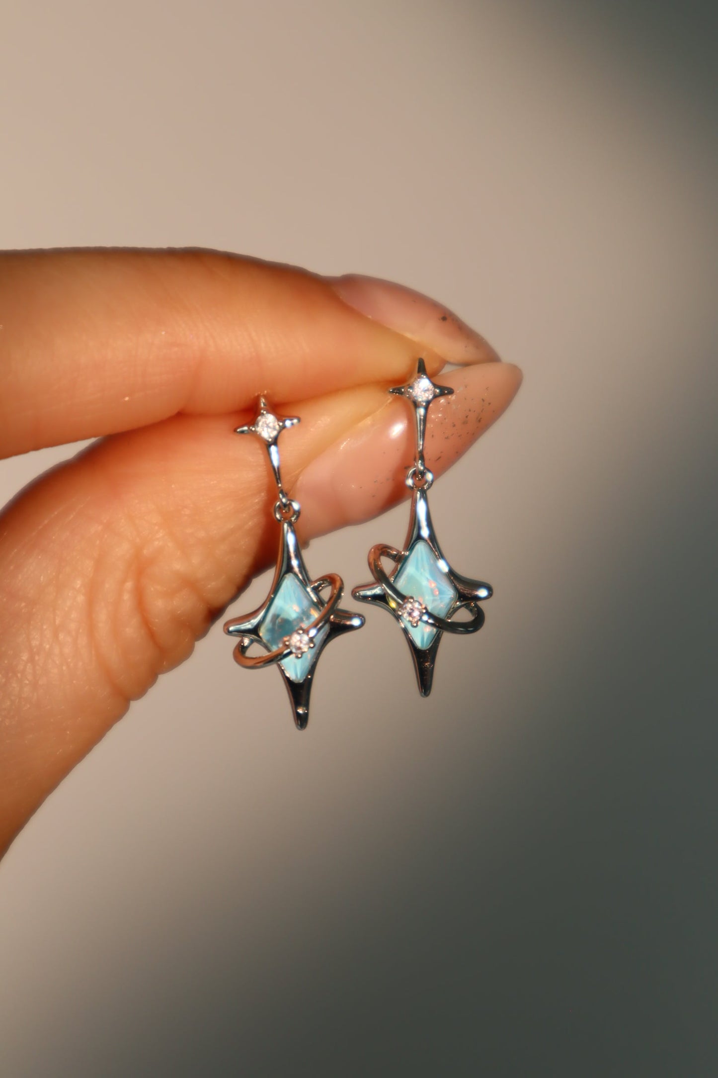 Palladium White Gold Plated Blue Saturn Star Earrings