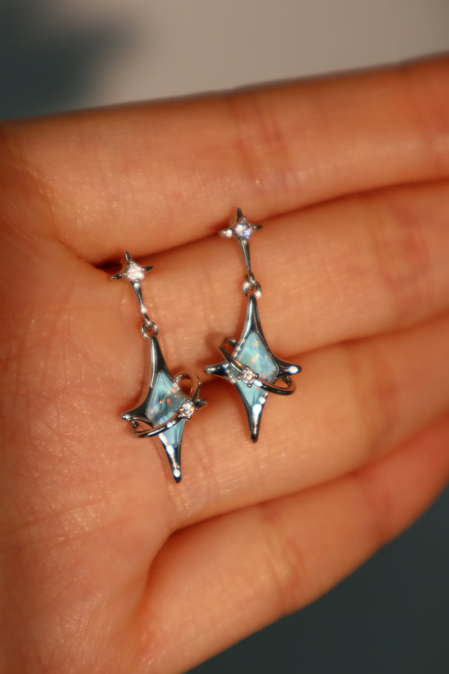 Palladium White Gold Plated Blue Saturn Star Earrings